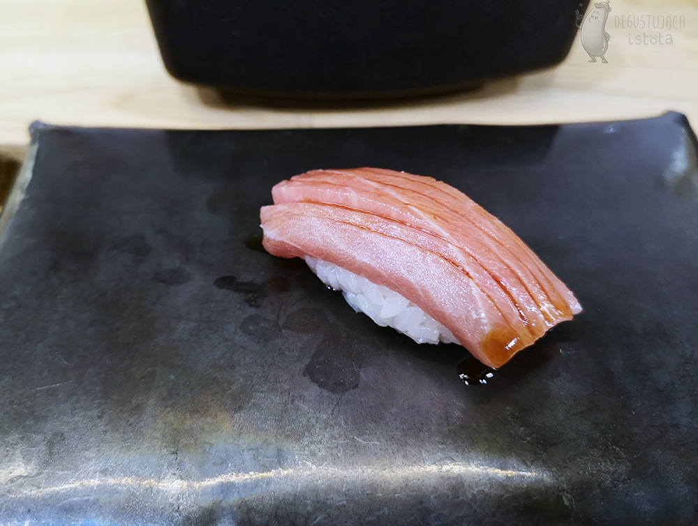 Nigiri with pink tuna meat.
